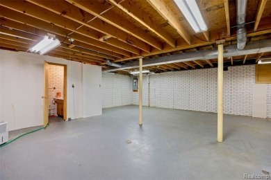 Expansive 2,184 sq. ft. home with a 1,456 sq. ft. basement and on West Shore Golf and Country Club in Michigan - for sale on GolfHomes.com, golf home, golf lot