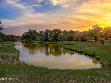 This beautiful pond front lot sits on a lovely street just a on River Landing Golf Course in North Carolina - for sale on GolfHomes.com, golf home, golf lot