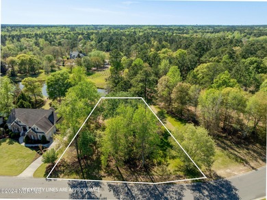 This beautiful pond front lot sits on a lovely street just a on River Landing Golf Course in North Carolina - for sale on GolfHomes.com, golf home, golf lot