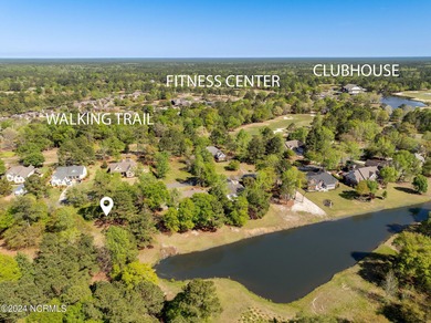 This beautiful pond front lot sits on a lovely street just a on River Landing Golf Course in North Carolina - for sale on GolfHomes.com, golf home, golf lot