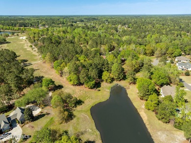 This beautiful pond front lot sits on a lovely street just a on River Landing Golf Course in North Carolina - for sale on GolfHomes.com, golf home, golf lot