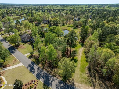 This beautiful pond front lot sits on a lovely street just a on River Landing Golf Course in North Carolina - for sale on GolfHomes.com, golf home, golf lot