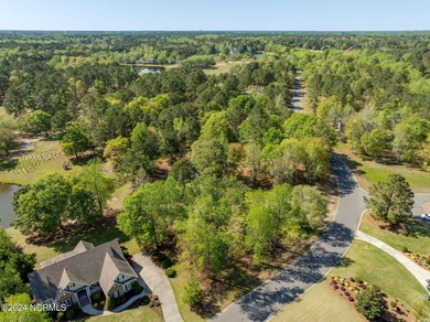 This beautiful pond front lot sits on a lovely street just a on River Landing Golf Course in North Carolina - for sale on GolfHomes.com, golf home, golf lot