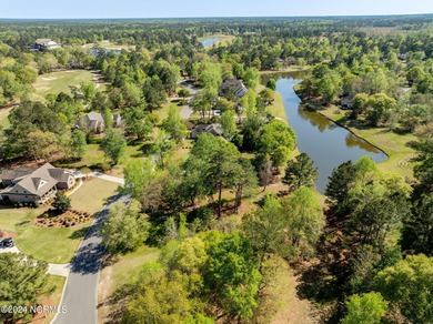 This beautiful pond front lot sits on a lovely street just a on River Landing Golf Course in North Carolina - for sale on GolfHomes.com, golf home, golf lot