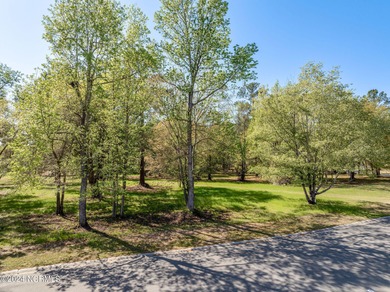 This beautiful pond front lot sits on a lovely street just a on River Landing Golf Course in North Carolina - for sale on GolfHomes.com, golf home, golf lot