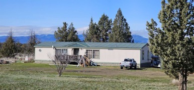 Nestled beneath the gaze of majestic Mt. Shasta, this charming on Lake Shastina Golf Course in California - for sale on GolfHomes.com, golf home, golf lot