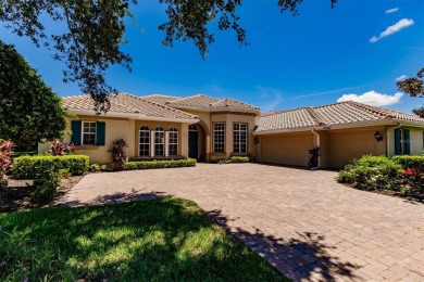 This stunning Mediterranean style stucco home is on a golf on Venetian Golf and River Club in Florida - for sale on GolfHomes.com, golf home, golf lot