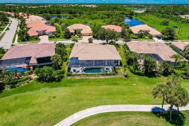 This stunning Mediterranean style stucco home is on a golf on Venetian Golf and River Club in Florida - for sale on GolfHomes.com, golf home, golf lot