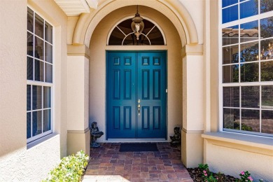 This stunning Mediterranean style stucco home is on a golf on Venetian Golf and River Club in Florida - for sale on GolfHomes.com, golf home, golf lot