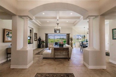 This stunning Mediterranean style stucco home is on a golf on Venetian Golf and River Club in Florida - for sale on GolfHomes.com, golf home, golf lot