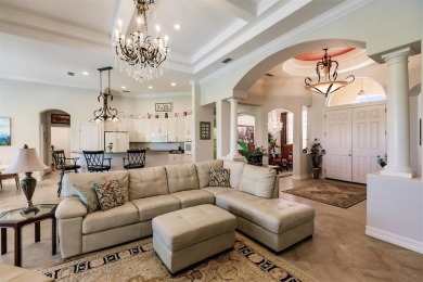 This stunning Mediterranean style stucco home is on a golf on Venetian Golf and River Club in Florida - for sale on GolfHomes.com, golf home, golf lot