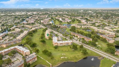 Reduced to sell!! Top Floor, Corner Unit, spacious and open with on Sunrise Lakes Phase III in Florida - for sale on GolfHomes.com, golf home, golf lot