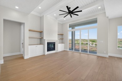 Experience breathtaking views of the city, mountains, and golf on Coral Canyon Golf Course in Utah - for sale on GolfHomes.com, golf home, golf lot