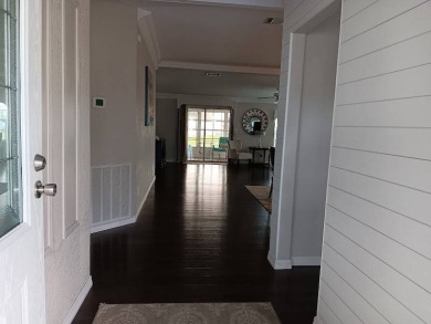 Great kitchen area with pass through counter and open walkway to on Four Lakes Golf Club in Florida - for sale on GolfHomes.com, golf home, golf lot