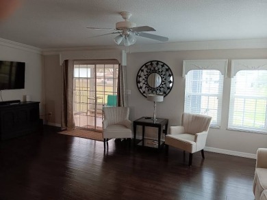 Great kitchen area with pass through counter and open walkway to on Four Lakes Golf Club in Florida - for sale on GolfHomes.com, golf home, golf lot