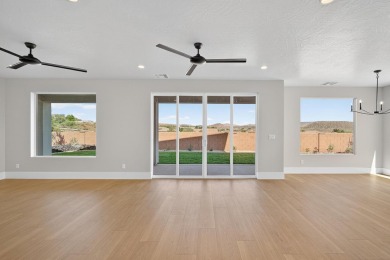 Experience breathtaking views of the city, mountains, and golf on Coral Canyon Golf Course in Utah - for sale on GolfHomes.com, golf home, golf lot