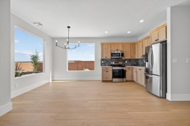 Experience breathtaking views of the city, mountains, and golf on Coral Canyon Golf Course in Utah - for sale on GolfHomes.com, golf home, golf lot