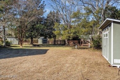 Discover this delightful 4 bedroom, 3 1/2 bath home that on Jacksonville Country Club in North Carolina - for sale on GolfHomes.com, golf home, golf lot