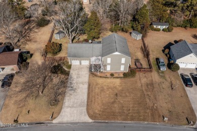 Discover this delightful 4 bedroom, 3 1/2 bath home that on Jacksonville Country Club in North Carolina - for sale on GolfHomes.com, golf home, golf lot