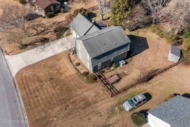 Discover this delightful 4 bedroom, 3 1/2 bath home that on Jacksonville Country Club in North Carolina - for sale on GolfHomes.com, golf home, golf lot