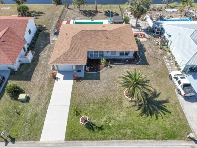 This fully furnished, three-bedroom, three-bathroom waterfront on Rotonda Golf and Country Club The Hills Course in Florida - for sale on GolfHomes.com, golf home, golf lot