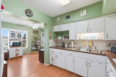 Welcome to this light and bright two-bedroom, two-bathroom condo on On Top Of The World Golf Course in Florida - for sale on GolfHomes.com, golf home, golf lot