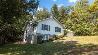 This well-cared-for 3-bedroom, 3-bath home offers comfort and on Cherokee Village North Course in Arkansas - for sale on GolfHomes.com, golf home, golf lot