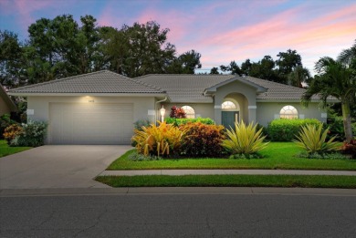 Enjoy stunning lake and golf course views framed by mature trees on Waterford Golf Club in Florida - for sale on GolfHomes.com, golf home, golf lot