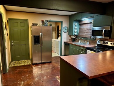 This beautiful home located in the prestigious Hideaway Lake on Hide-A-Way Lake Golf Course in Texas - for sale on GolfHomes.com, golf home, golf lot