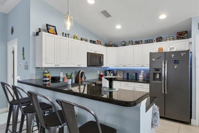 Designed to capture the best of its coastal locale, this on Pinemoor West Golf Club in Florida - for sale on GolfHomes.com, golf home, golf lot