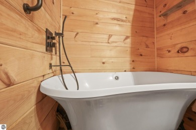 This 3-bedroom, 2-bath home in Kalkaska's Drydock community on Twin Birch Golf Club in Michigan - for sale on GolfHomes.com, golf home, golf lot