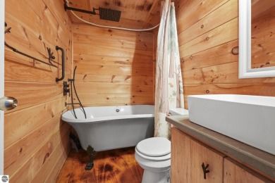 This 3-bedroom, 2-bath home in Kalkaska's Drydock community on Twin Birch Golf Club in Michigan - for sale on GolfHomes.com, golf home, golf lot