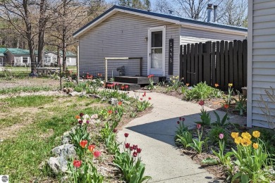 This 3-bedroom, 2-bath home in Kalkaska's Drydock community on Twin Birch Golf Club in Michigan - for sale on GolfHomes.com, golf home, golf lot