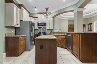 Welcome to this stunning custom-built 4-bedroom, 2.5-bath home on Diamondhead Country Club in Mississippi - for sale on GolfHomes.com, golf home, golf lot
