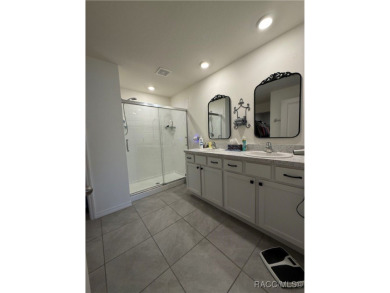 This almost new (built in 2022), beautifully designed 4-bedroom on Twisted Oaks Golf Club in Florida - for sale on GolfHomes.com, golf home, golf lot