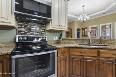 Welcome to this stunning custom-built 4-bedroom, 2.5-bath home on Diamondhead Country Club in Mississippi - for sale on GolfHomes.com, golf home, golf lot