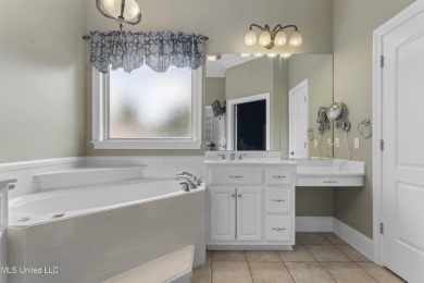 Welcome to this stunning custom-built 4-bedroom, 2.5-bath home on Diamondhead Country Club in Mississippi - for sale on GolfHomes.com, golf home, golf lot