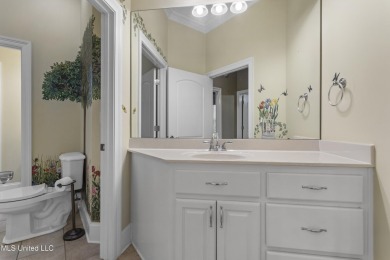 Welcome to this stunning custom-built 4-bedroom, 2.5-bath home on Diamondhead Country Club in Mississippi - for sale on GolfHomes.com, golf home, golf lot
