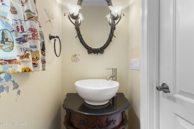 Welcome to this stunning custom-built 4-bedroom, 2.5-bath home on Diamondhead Country Club in Mississippi - for sale on GolfHomes.com, golf home, golf lot