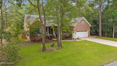 Step into this beautifully updated brick home tucked away in a on Harbour Point Golf Club in North Carolina - for sale on GolfHomes.com, golf home, golf lot