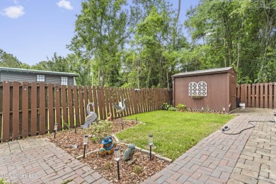 Welcome to this stunning custom-built 4-bedroom, 2.5-bath home on Diamondhead Country Club in Mississippi - for sale on GolfHomes.com, golf home, golf lot