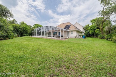 Halifax Plantation Estate home located on a large wooded lot in on Halifax Plantation Golf Club in Florida - for sale on GolfHomes.com, golf home, golf lot