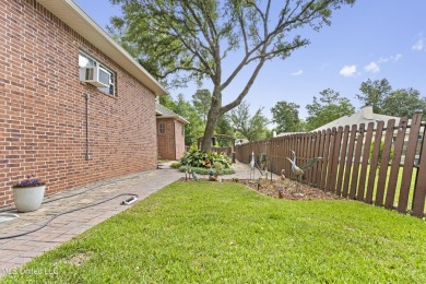 Welcome to this stunning custom-built 4-bedroom, 2.5-bath home on Diamondhead Country Club in Mississippi - for sale on GolfHomes.com, golf home, golf lot