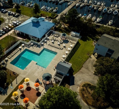 Step into this beautifully updated brick home tucked away in a on Harbour Point Golf Club in North Carolina - for sale on GolfHomes.com, golf home, golf lot
