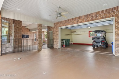 Welcome to this stunning custom-built 4-bedroom, 2.5-bath home on Diamondhead Country Club in Mississippi - for sale on GolfHomes.com, golf home, golf lot