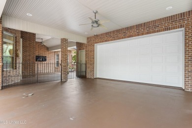 Welcome to this stunning custom-built 4-bedroom, 2.5-bath home on Diamondhead Country Club in Mississippi - for sale on GolfHomes.com, golf home, golf lot