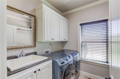 Discover unparalleled luxury at 1776 Traditions Way, an on Traditions of Braselton Golf Club in Georgia - for sale on GolfHomes.com, golf home, golf lot