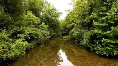 Creekfront Acreage for Sale in Hardy Arkansas! Escape to this on Cherokee Village North Course in Arkansas - for sale on GolfHomes.com, golf home, golf lot