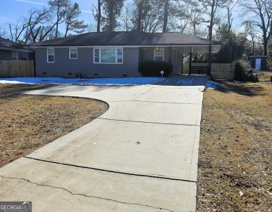 Welcome to this charming 3-bedroom, 2-bath home in the heart of on Charlie Yates Golf Course in Georgia - for sale on GolfHomes.com, golf home, golf lot