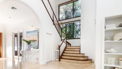 Luxury single-family home in Coral Ridge Estates within the on Coral Ridge Country Club in Florida - for sale on GolfHomes.com, golf home, golf lot